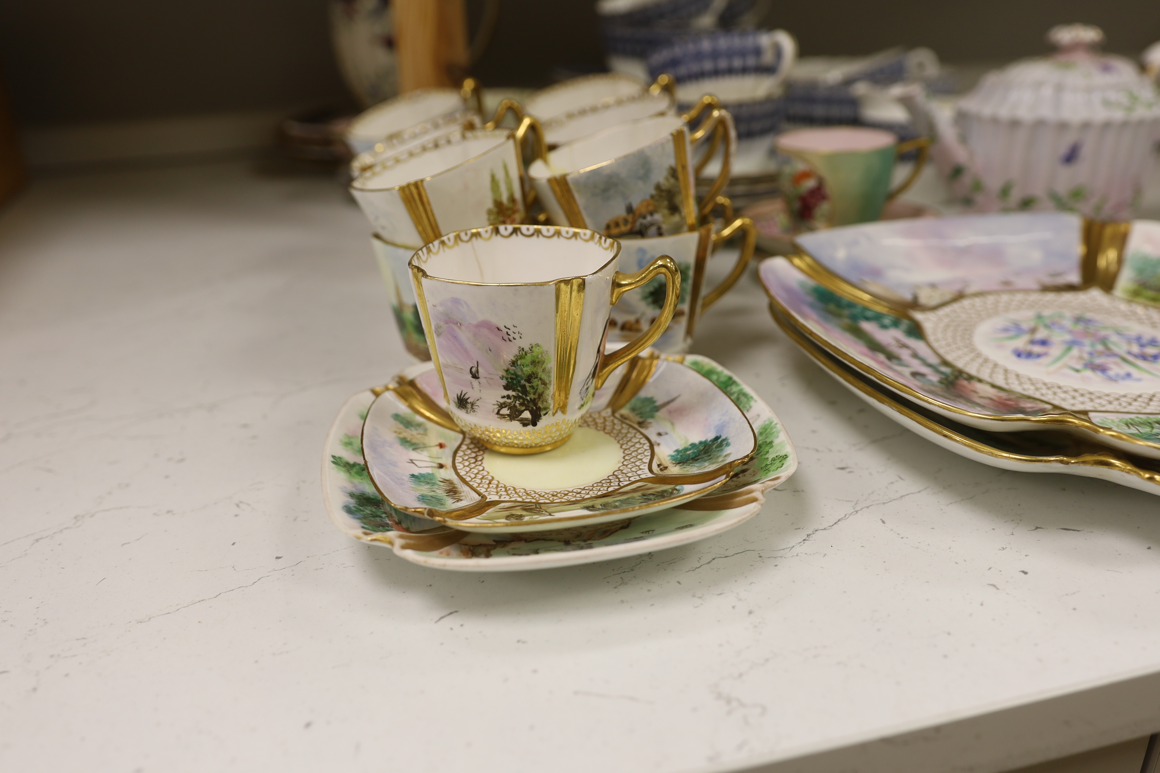 A Copeland Spode porcelain part tea set and two dishes, painted with scenes after Birkett Foster, a blue and white teaset and other teaware, Copeland Spode dishes 25cm wide